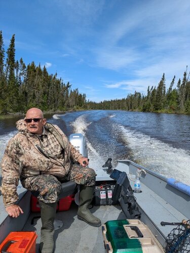 Jim Driving on Onaman River.jpg